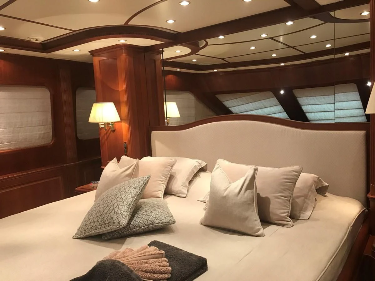 a bed with pillows and pillows aboard LADY ANN Yacht for Sale