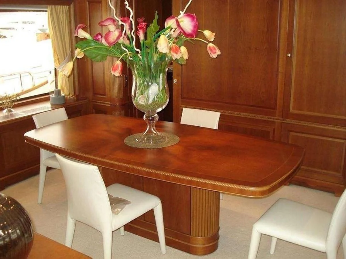 a vase of flowers on a table aboard LADY ANN Yacht for Sale