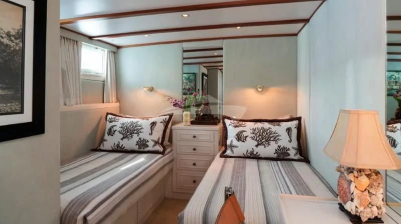 a couple of beds in a bedroom aboard SEAFARI Yacht for Sale