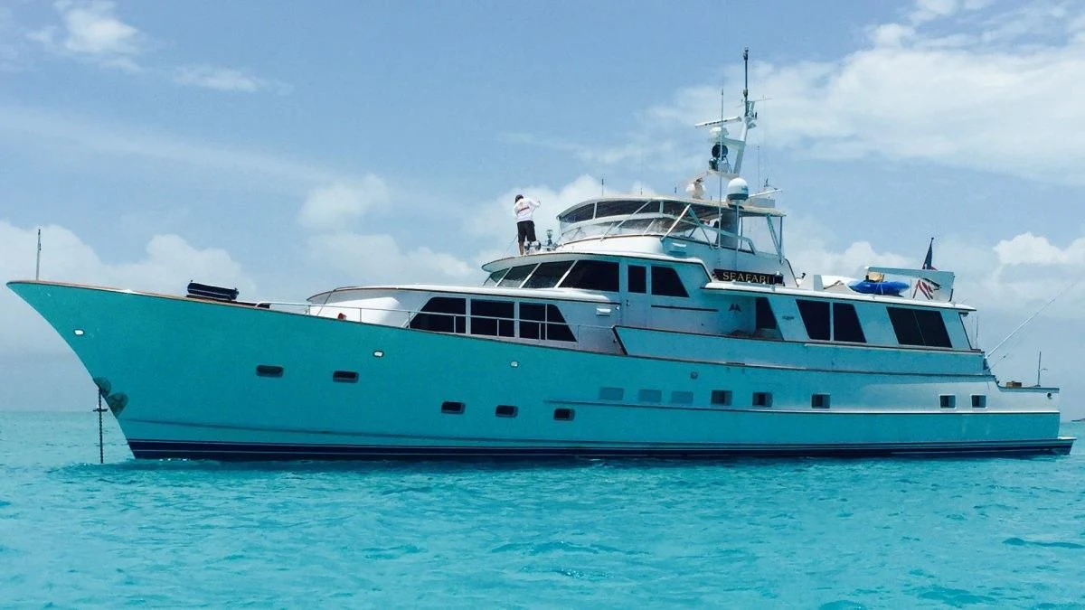 a large white boat in the water aboard SEAFARI Yacht for Sale