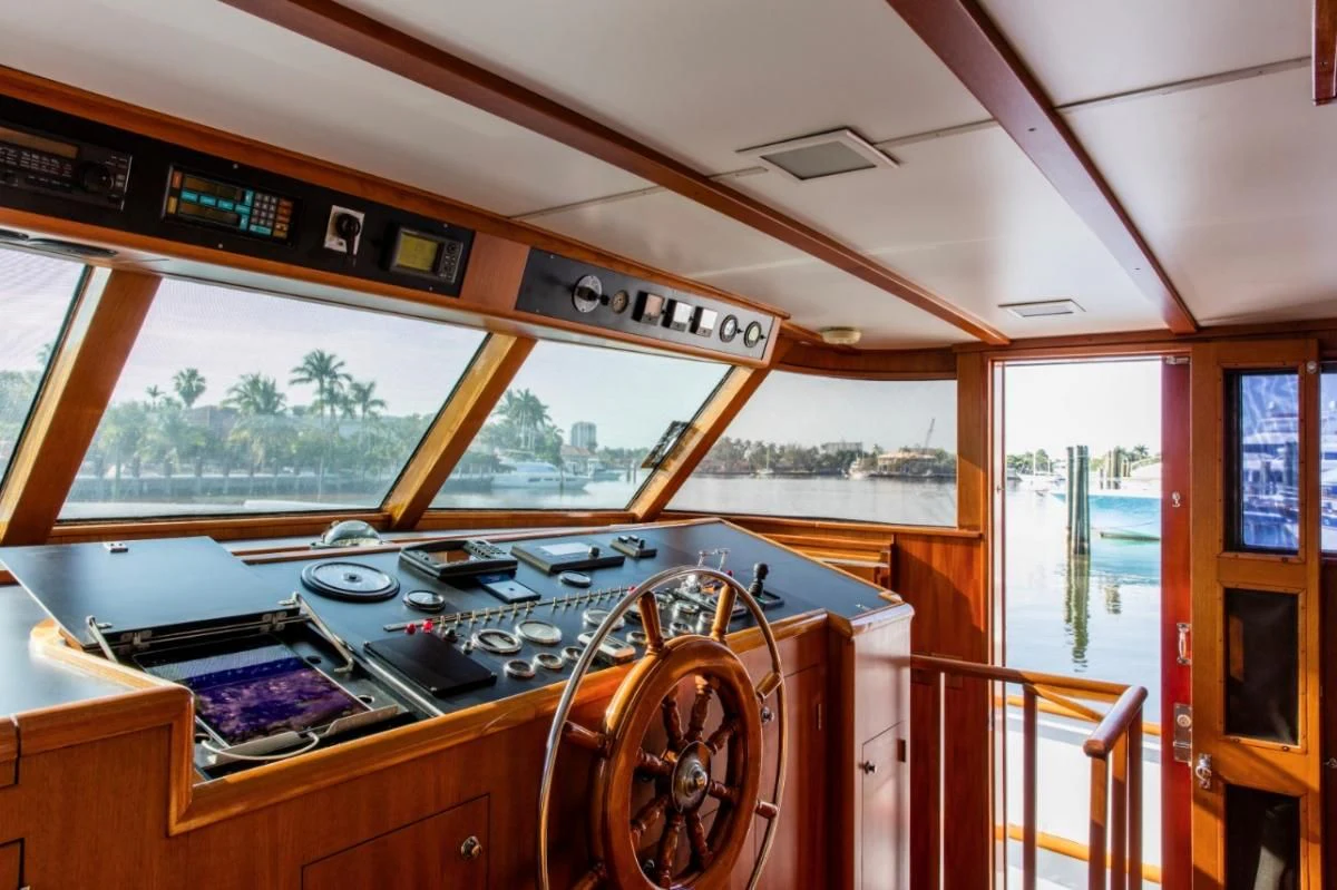a wooden cabin with a wood stove and a wood door aboard SEAFARI Yacht for Sale