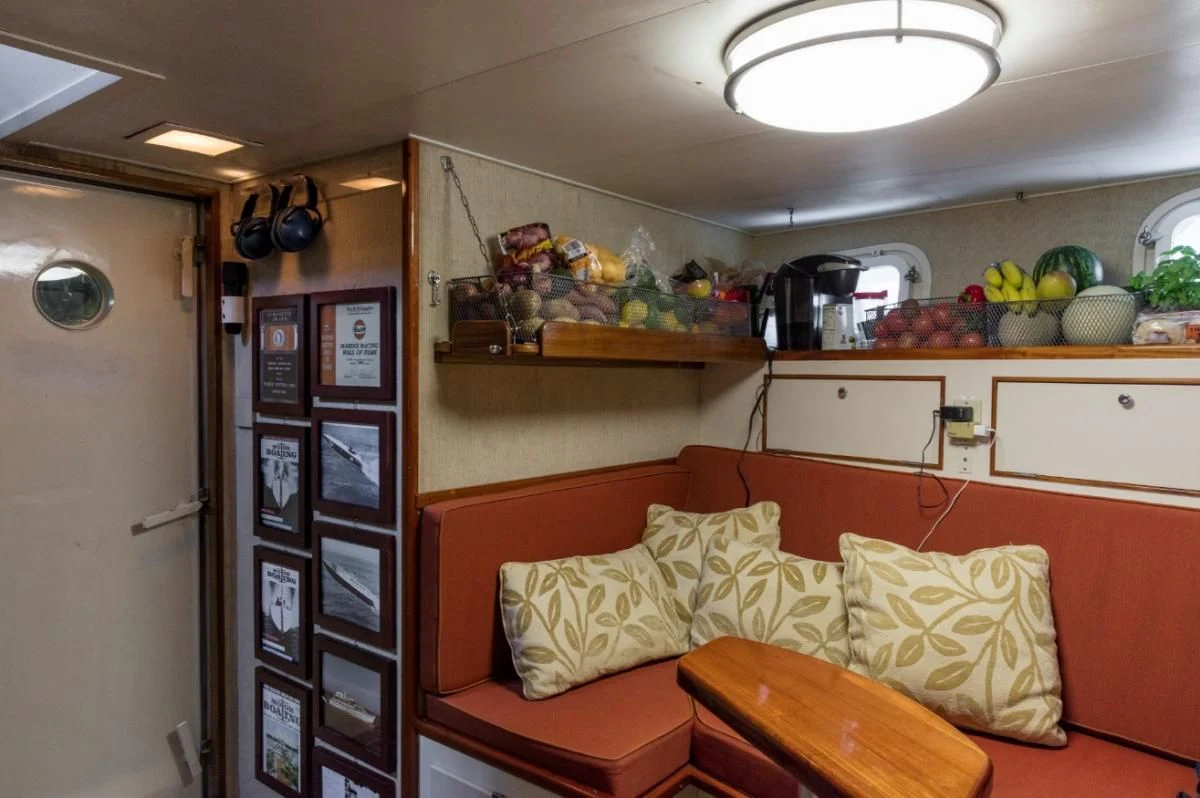 a room with a couch and a table aboard SEAFARI Yacht for Sale