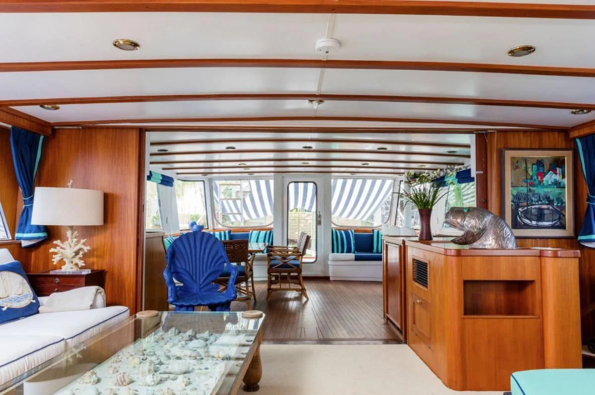 a room with a bed and a desk aboard SEAFARI Yacht for Sale