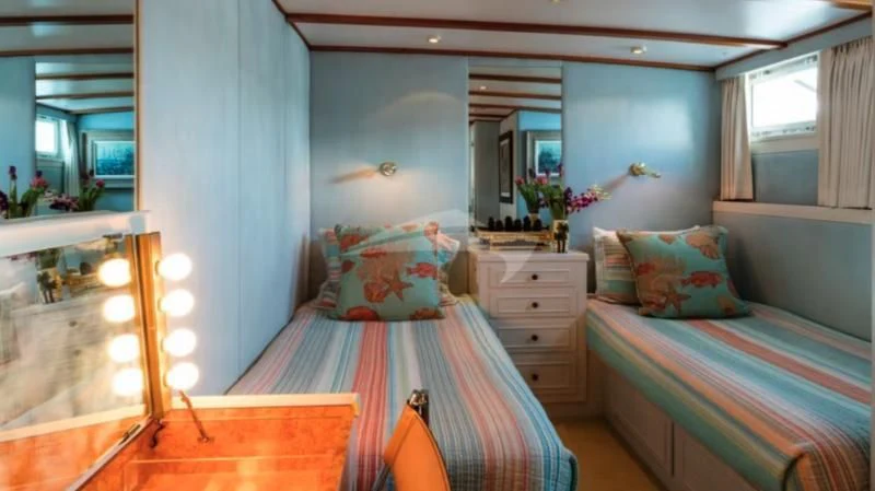 a bedroom with two beds aboard SEAFARI Yacht for Sale