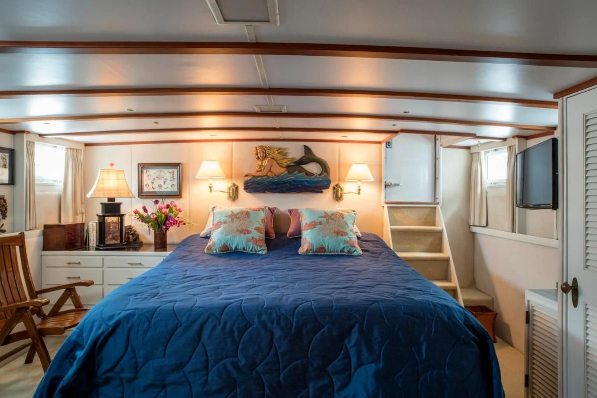 a large bed in a room aboard SEAFARI Yacht for Sale