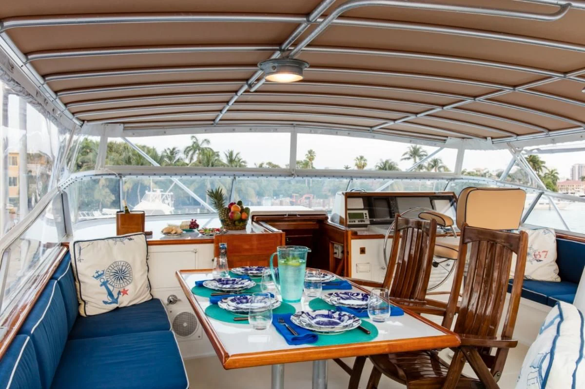 a tent with a table and chairs aboard SEAFARI Yacht for Sale