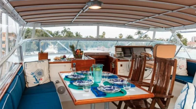 a tent with a table and chairs aboard SEAFARI Yacht for Sale