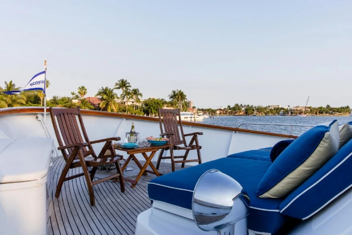 a pool with chairs and tables aboard SEAFARI Yacht for Sale