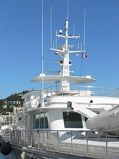 a large white boat with a flag on it aboard OKEANIS Yacht for Sale