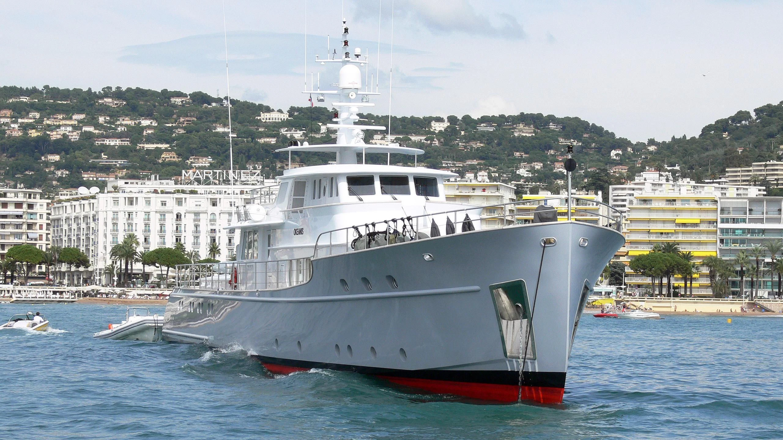 a large white boat on the water aboard OKEANIS Yacht for Sale