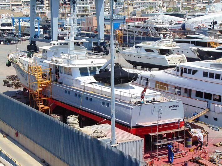 a group of boats are parked in a harbor aboard OKEANIS Yacht for Sale