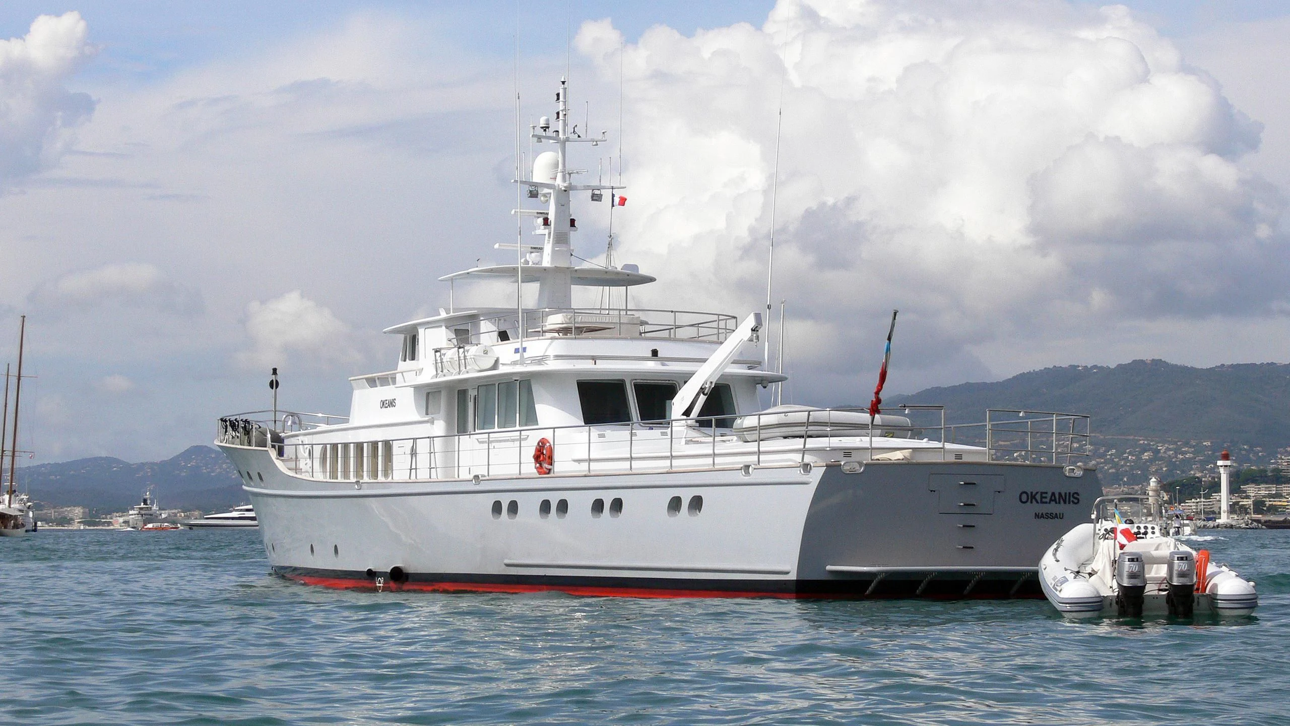a large white boat in the water aboard OKEANIS Yacht for Sale
