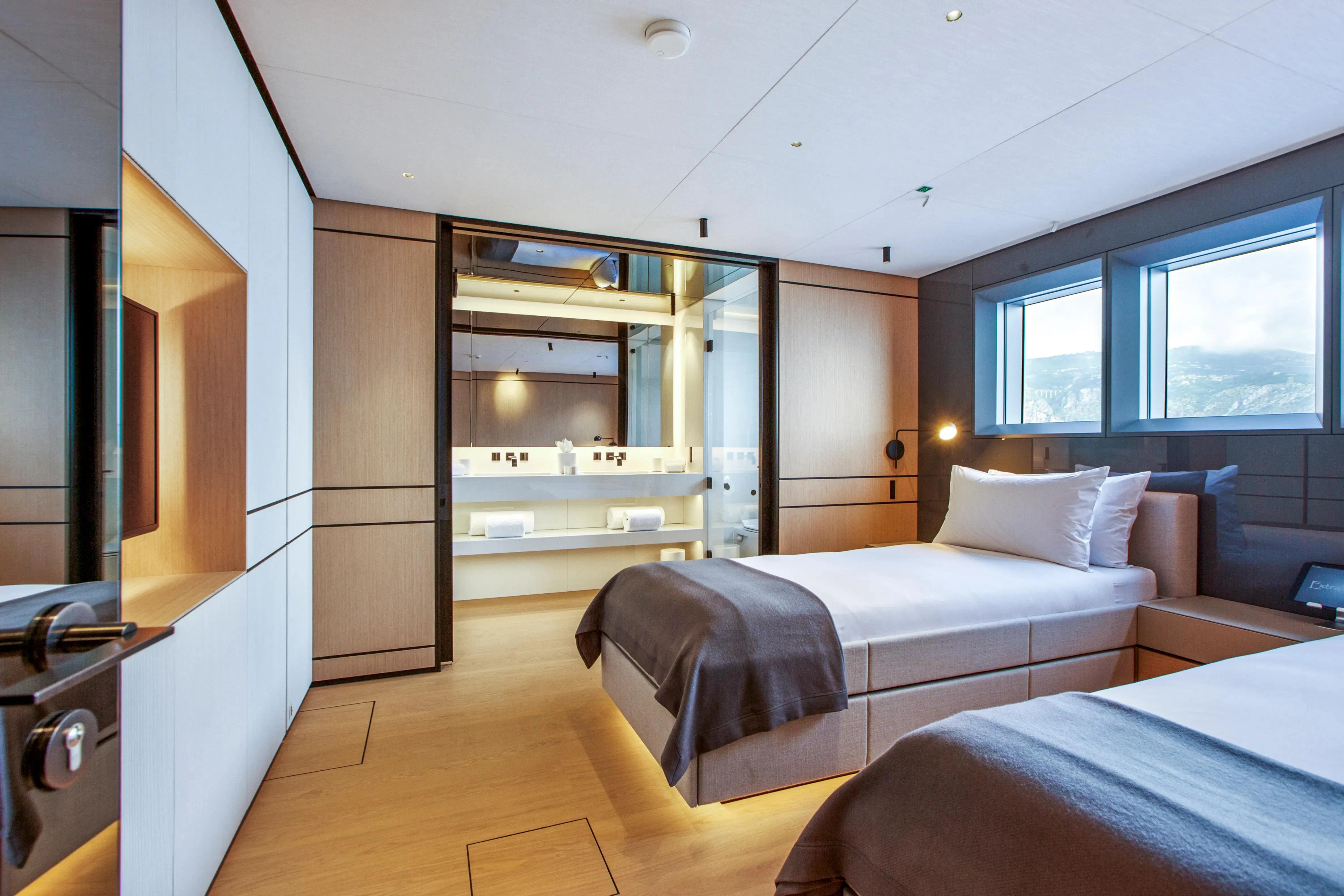 a room with a bed and a sink aboard EXTRA TIME Yacht for Sale