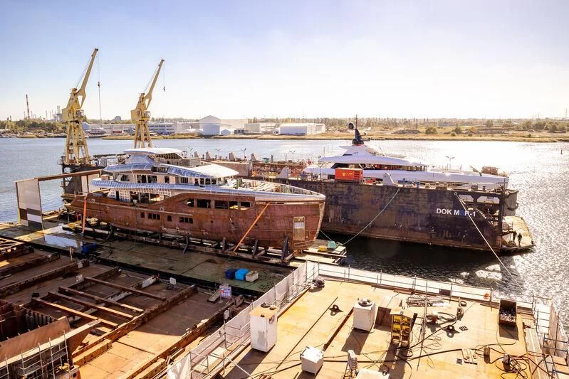 a large ship docked aboard EXTRA TIME Yacht for Sale