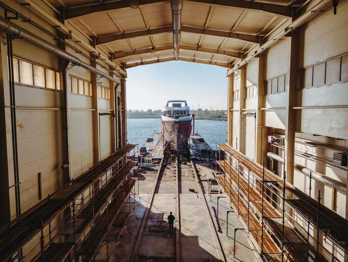 a boat in a canal aboard EXTRA TIME Yacht for Sale