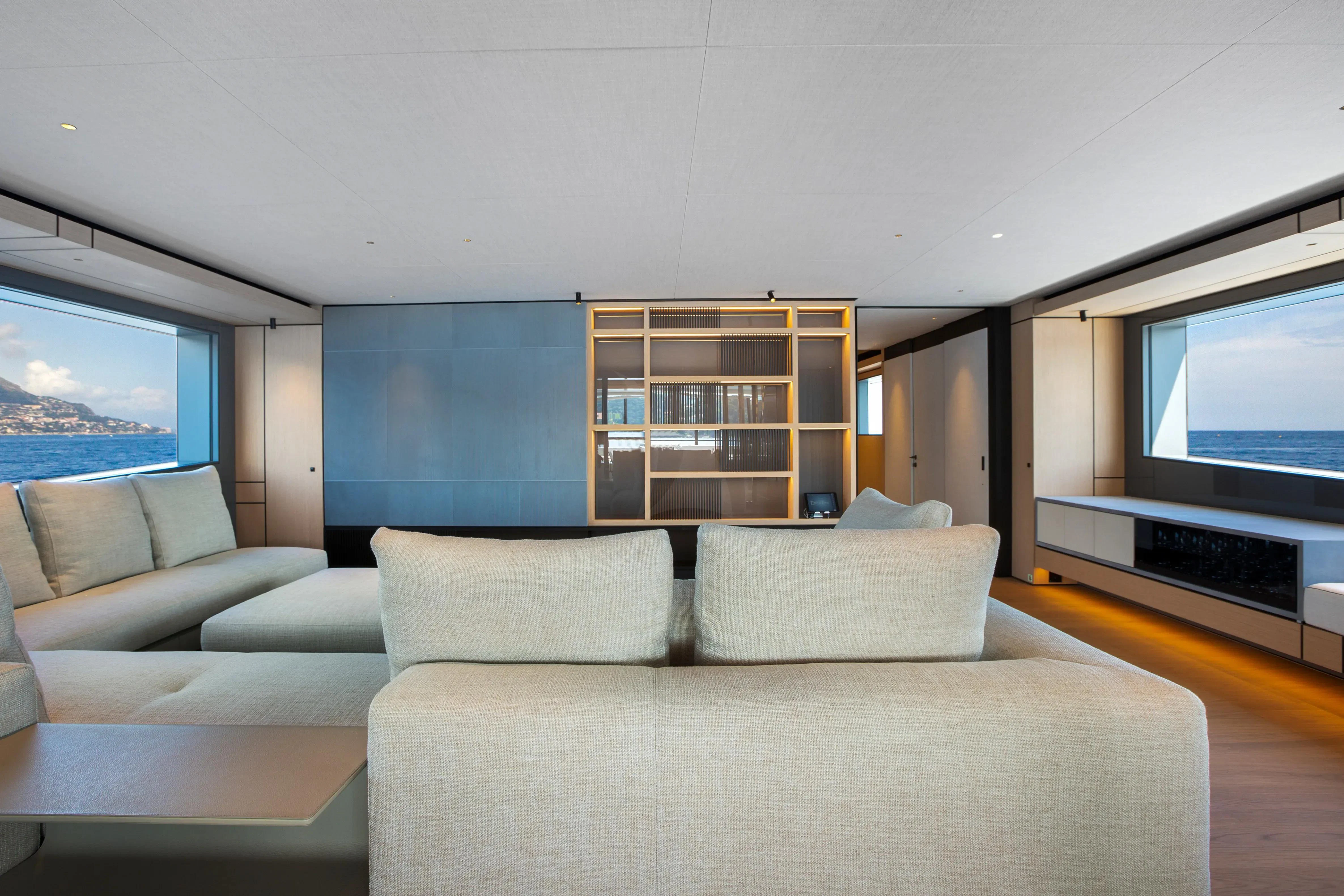 a living room with a large window aboard EXTRA TIME Yacht for Sale