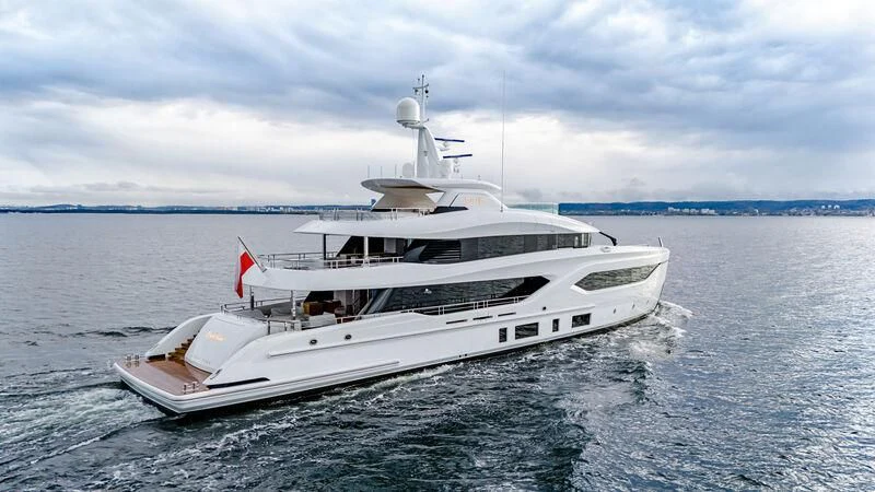 a white yacht in the water aboard EXTRA TIME Yacht for Sale
