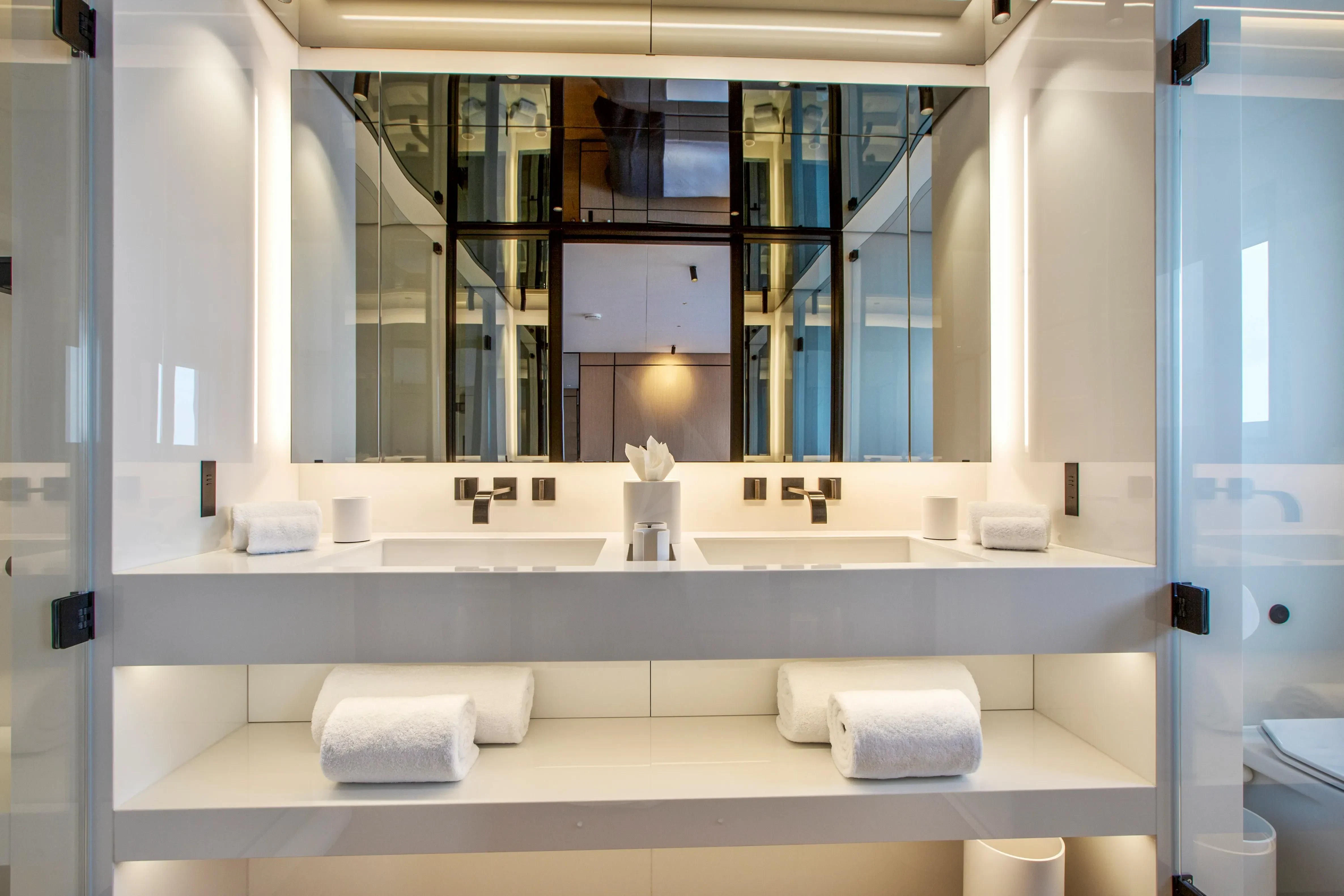 a bathroom with a large mirror aboard EXTRA TIME Yacht for Sale