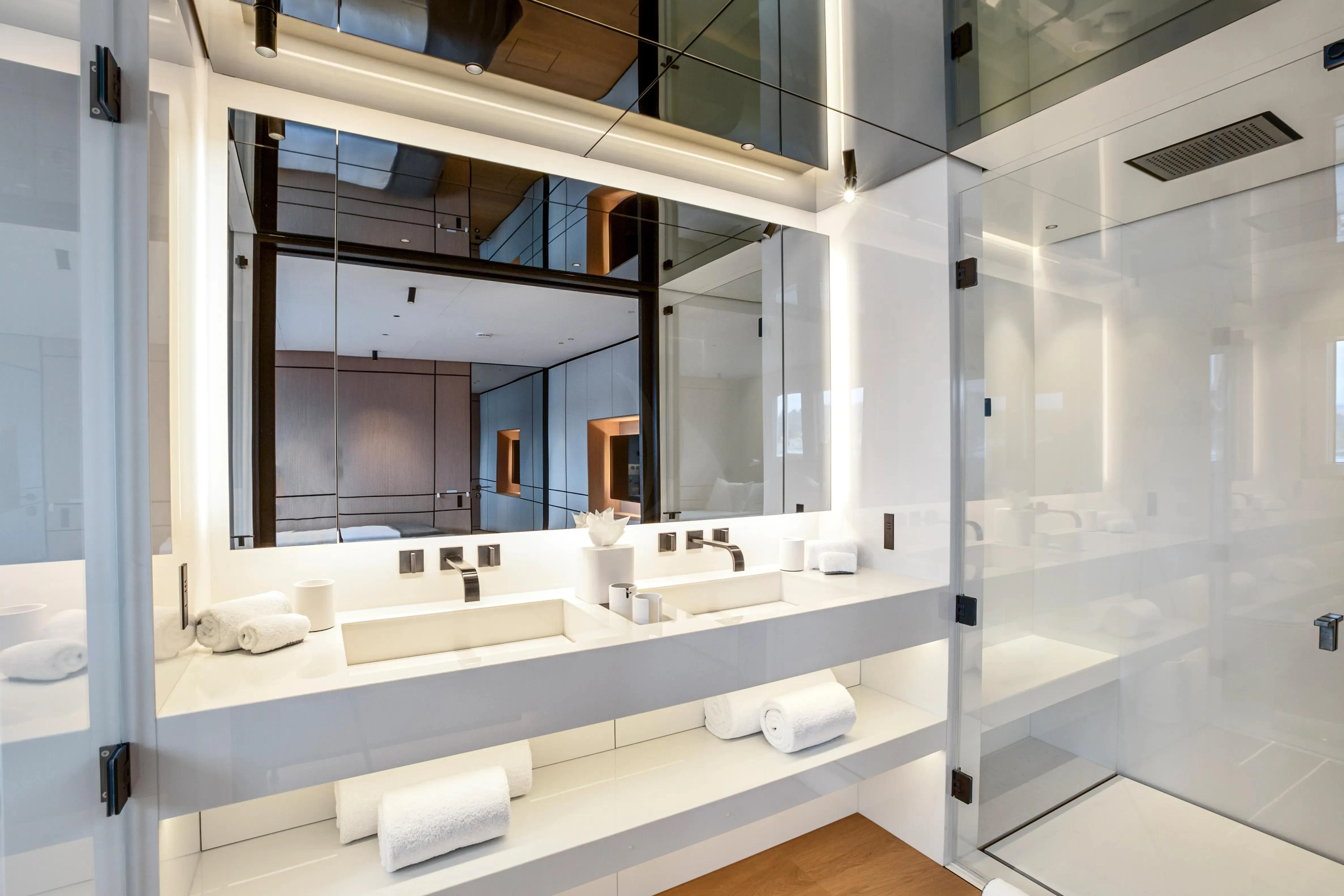 a bathroom with a large mirror aboard EXTRA TIME Yacht for Sale