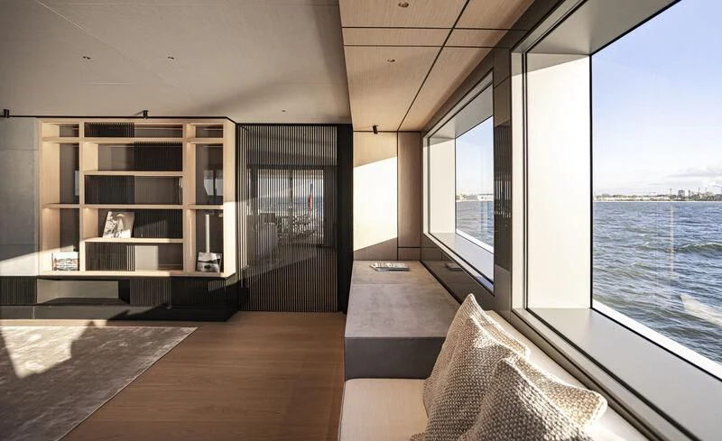 a room with a large window and a view of the water aboard EXTRA TIME Yacht for Sale