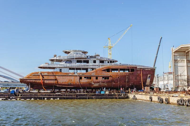 a large ship docked aboard EXTRA TIME Yacht for Sale