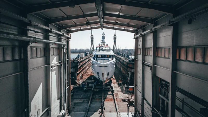 a boat in a canal aboard EXTRA TIME Yacht for Sale