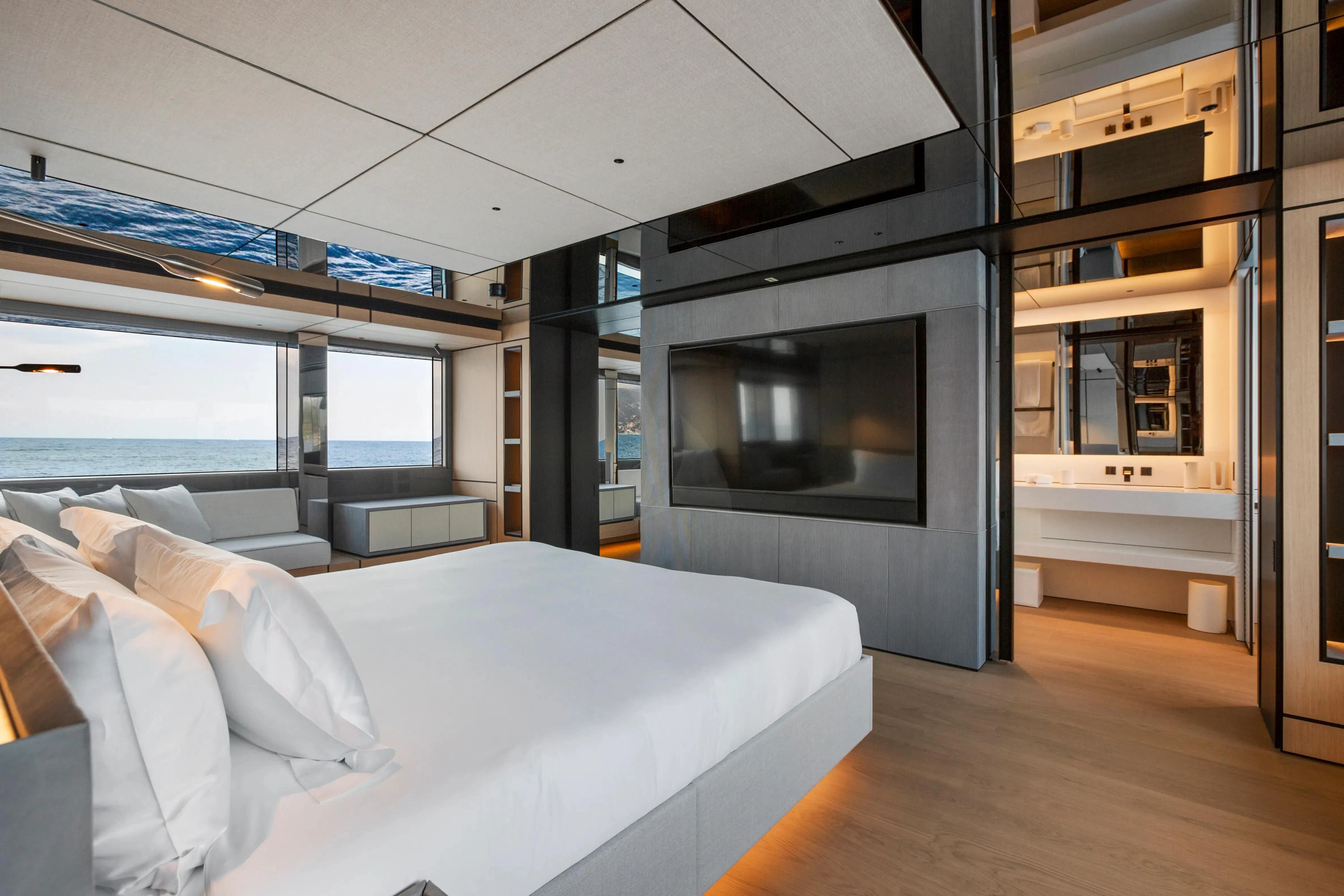 a room with a bed and a tv aboard EXTRA TIME Yacht for Sale