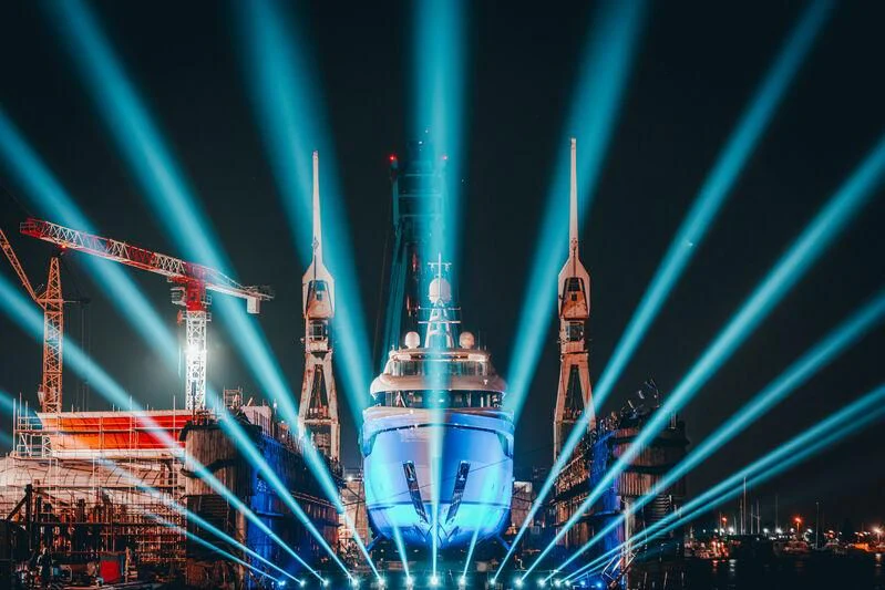 a large ferris wheel at night aboard EXTRA TIME Yacht for Sale