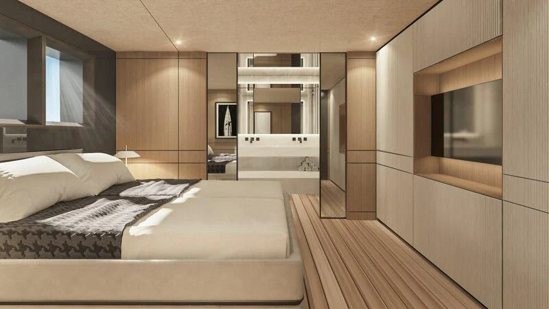 a room with a bed and a mirror aboard EXTRA TIME Yacht for Sale