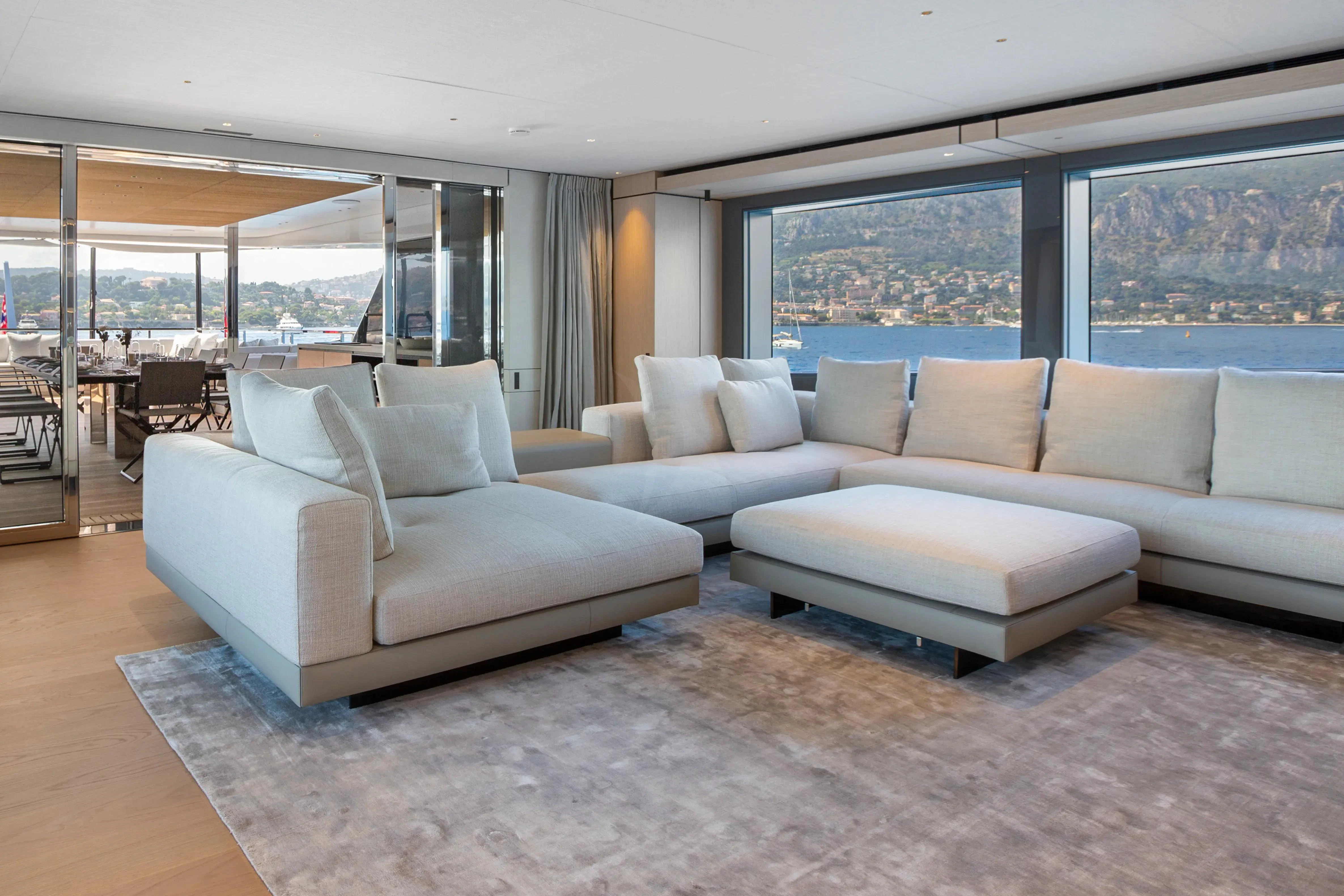 a living room with a large window aboard EXTRA TIME Yacht for Sale