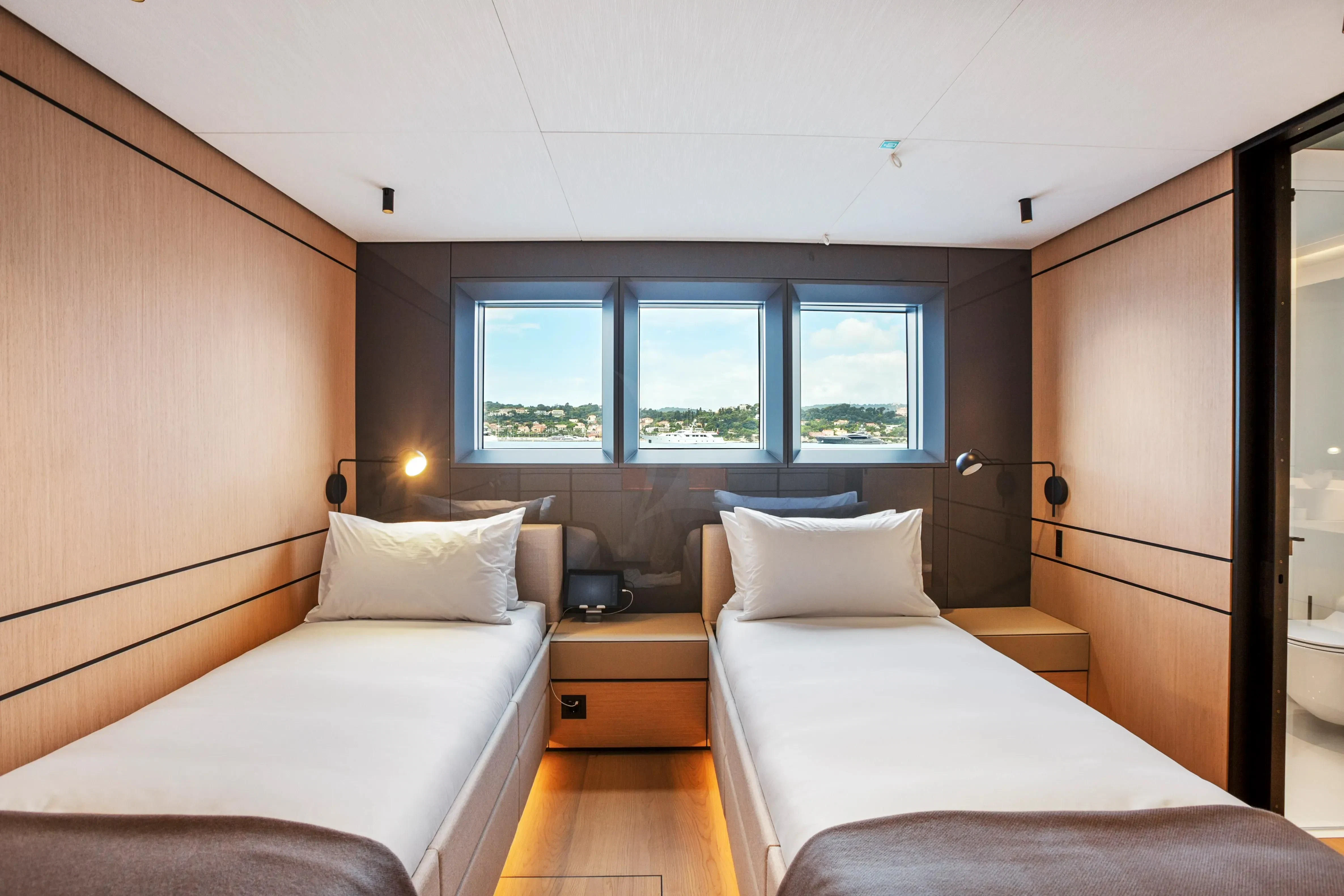 a room with two beds aboard EXTRA TIME Yacht for Sale