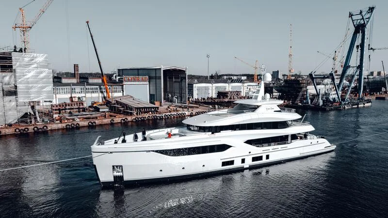 a white boat in the water aboard EXTRA TIME Yacht for Sale