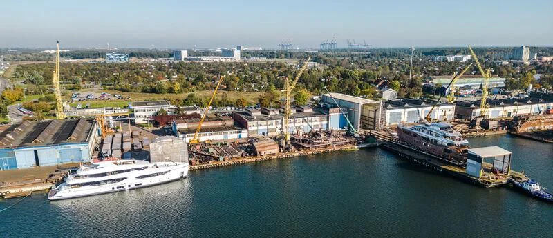 a body of water with boats and buildings in the background aboard EXTRA TIME Yacht for Sale