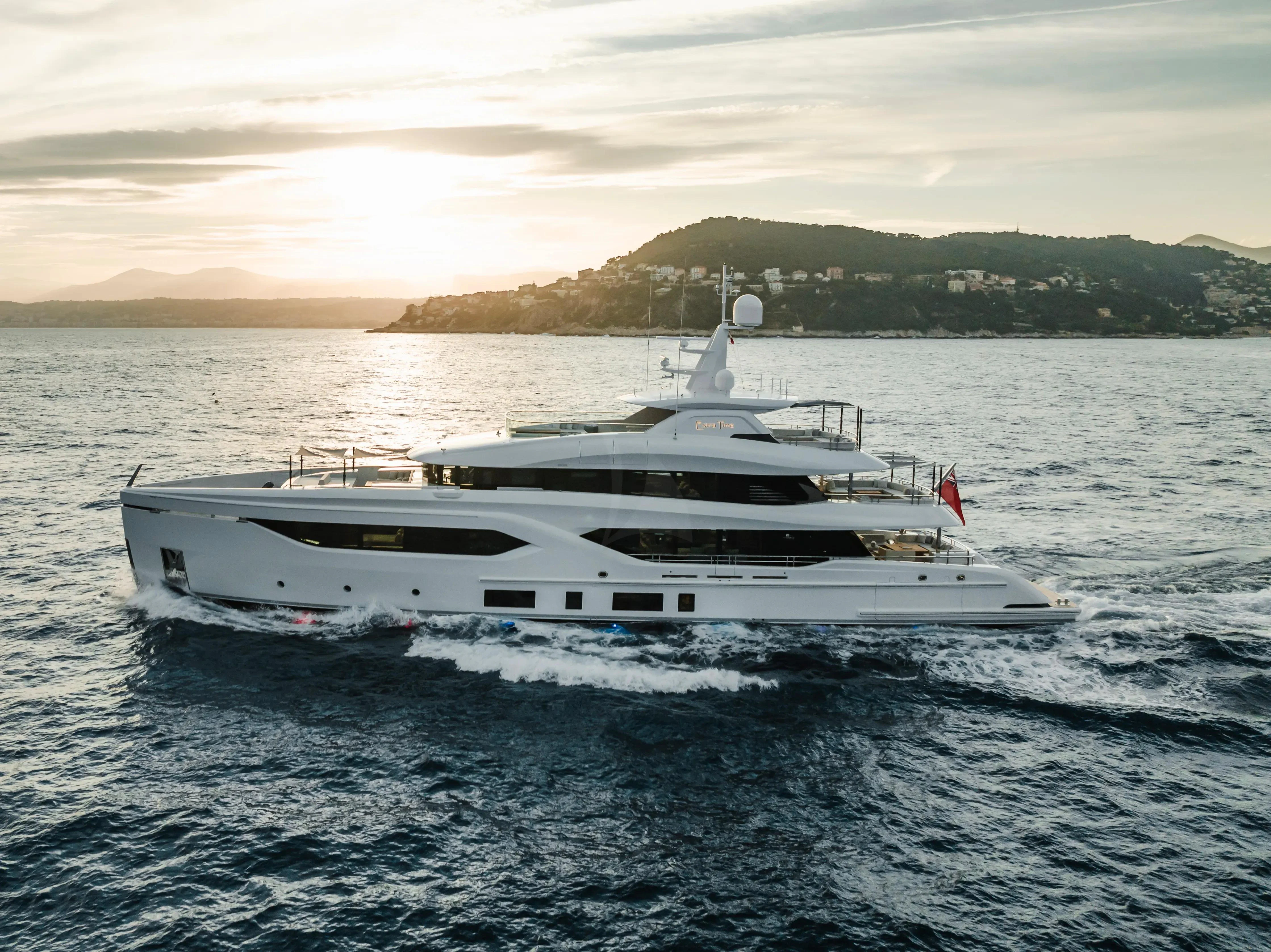 a white yacht in the water aboard EXTRA TIME Yacht for Sale