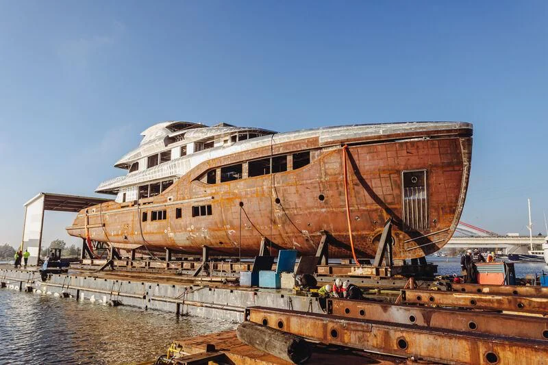 a large ship docked aboard EXTRA TIME Yacht for Sale