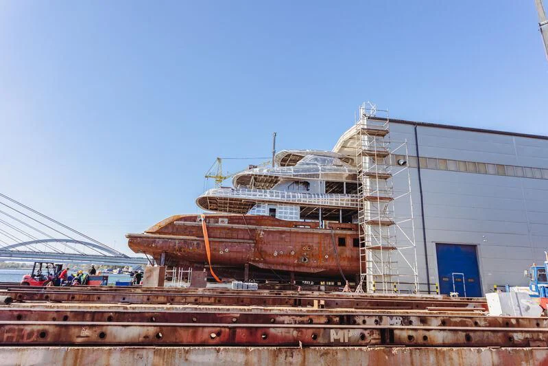 a large ship docked aboard EXTRA TIME Yacht for Sale