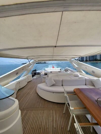 a table and chairs on a deck aboard EAGLE WINGS 3 Yacht for Sale