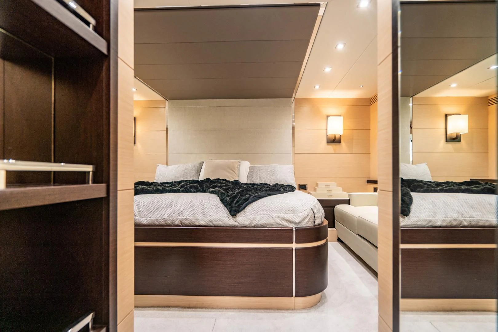 a room with a bed and a mirror aboard SUBMARINO Yacht for Sale