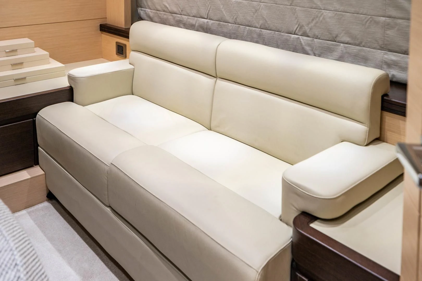 a couch with a white pillow aboard SUBMARINO Yacht for Sale