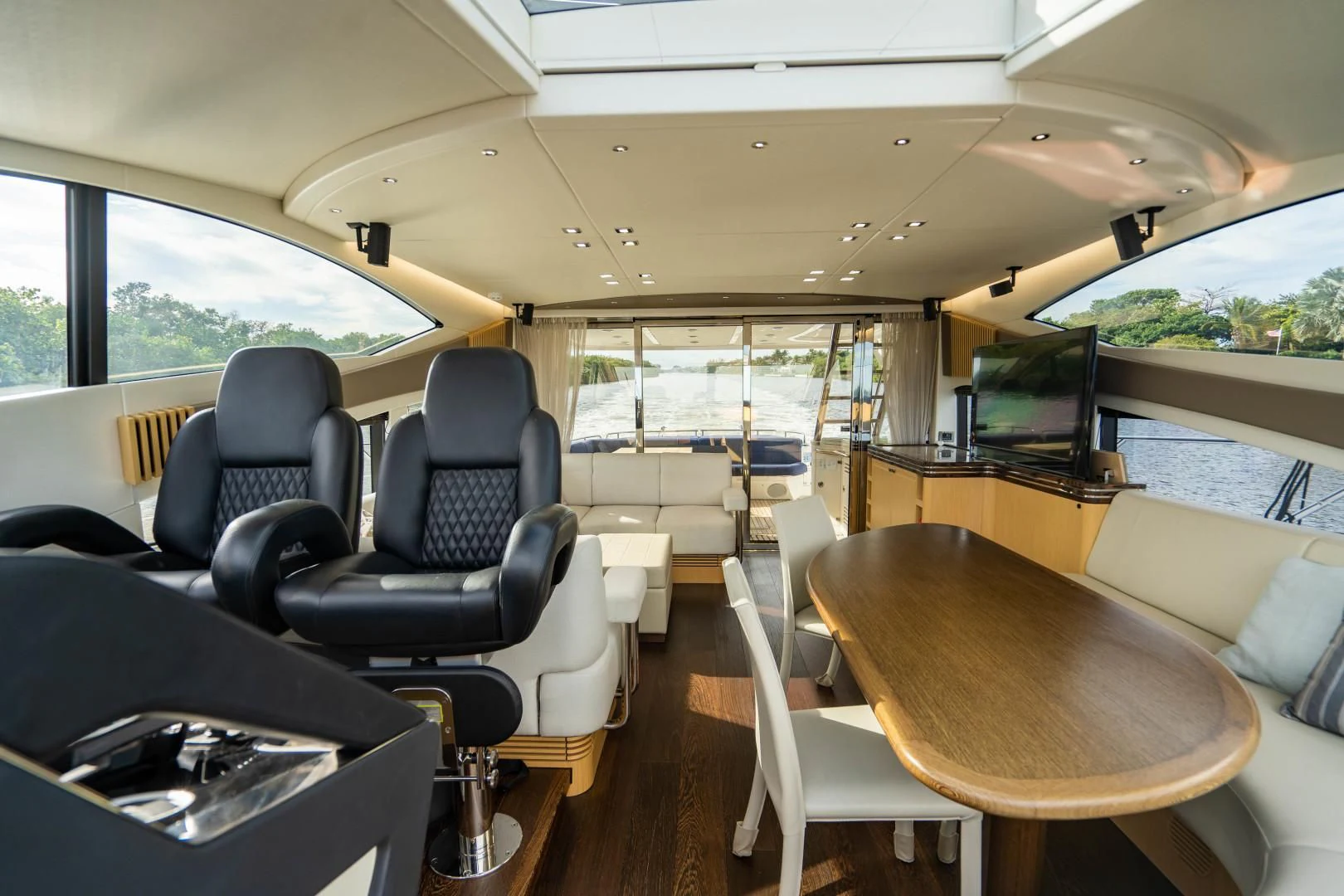 inside of a vehicle with a table and chairs and a large window aboard SUBMARINO Yacht for Sale