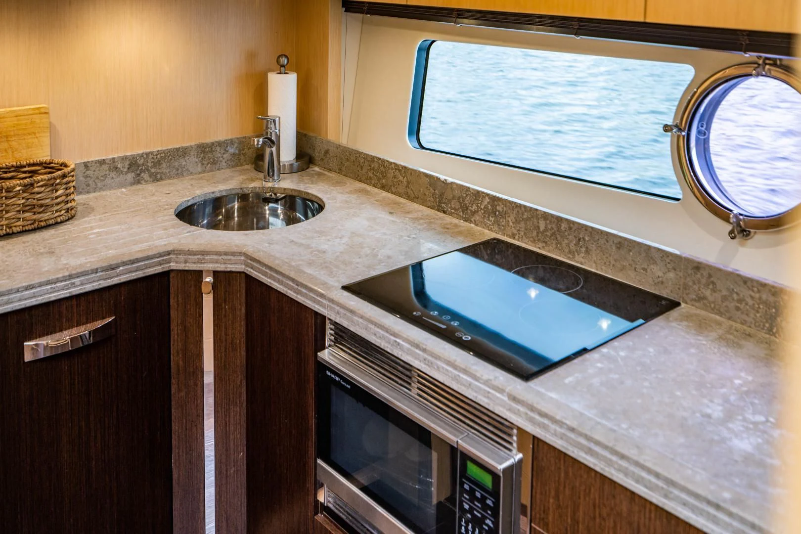 a counter top with a sink and microwave aboard SUBMARINO Yacht for Sale