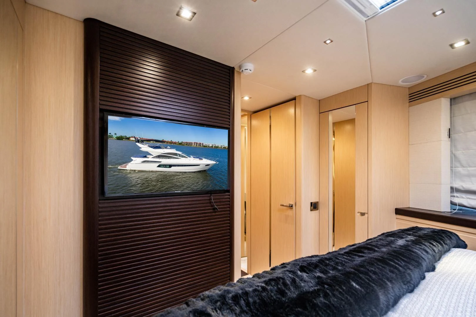 a tv on a wall in a bedroom aboard SUBMARINO Yacht for Sale