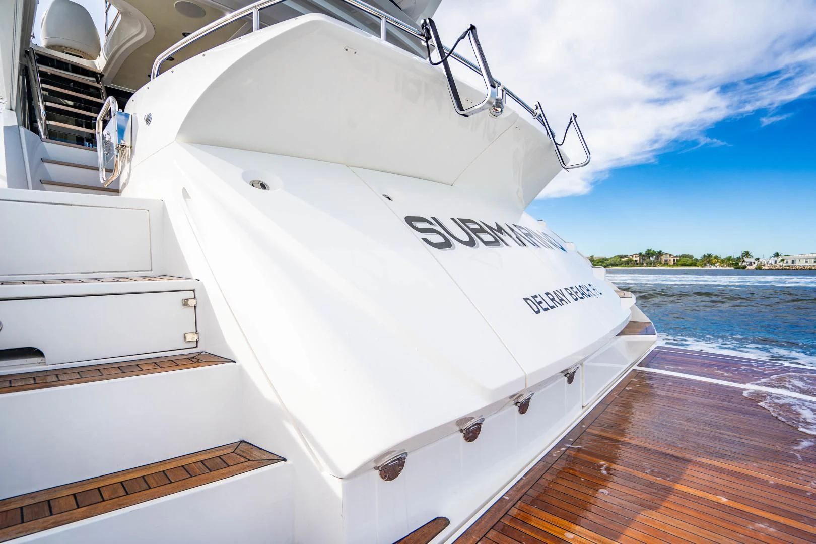 a white boat on a dock aboard SUBMARINO Yacht for Sale