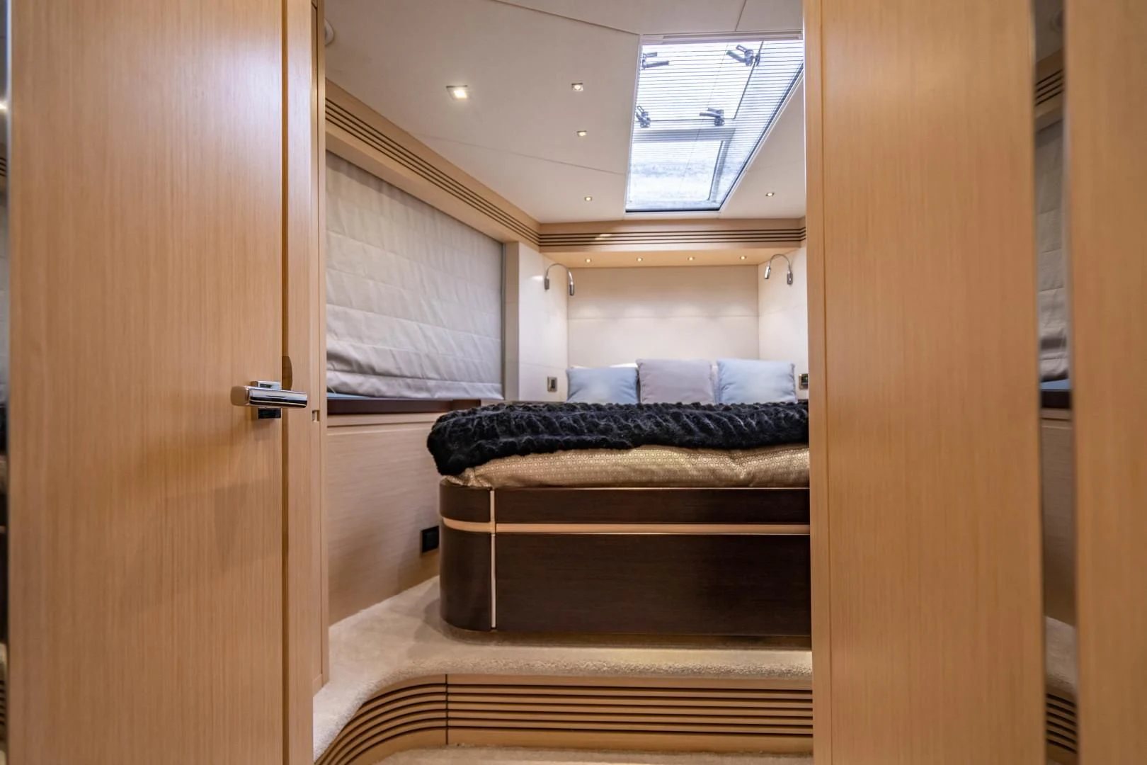 a room with a couch and a wood door aboard SUBMARINO Yacht for Sale
