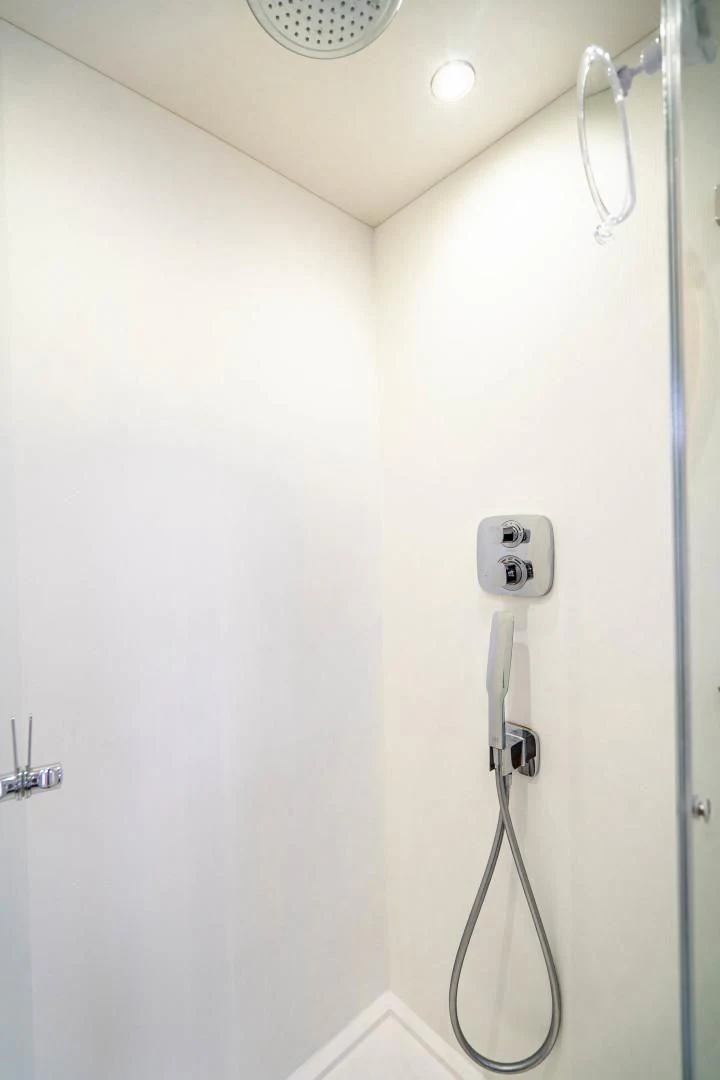 a white wall with a telephone and a white wall aboard SUBMARINO Yacht for Sale