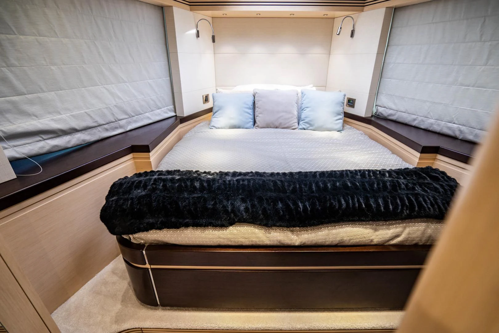 a bed with a black blanket aboard SUBMARINO Yacht for Sale