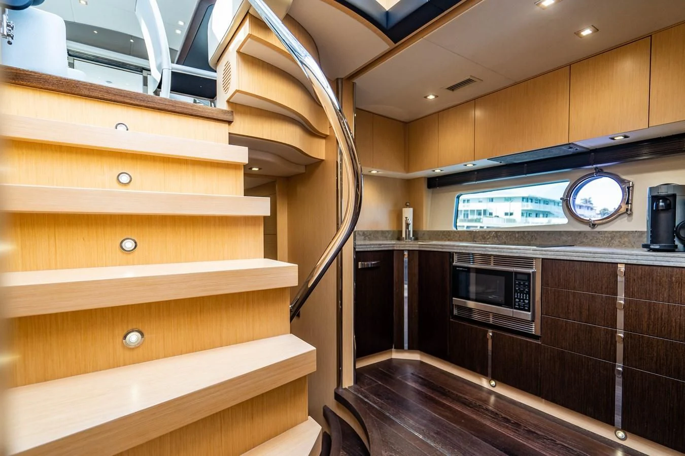 a kitchen with wooden cabinets aboard SUBMARINO Yacht for Sale