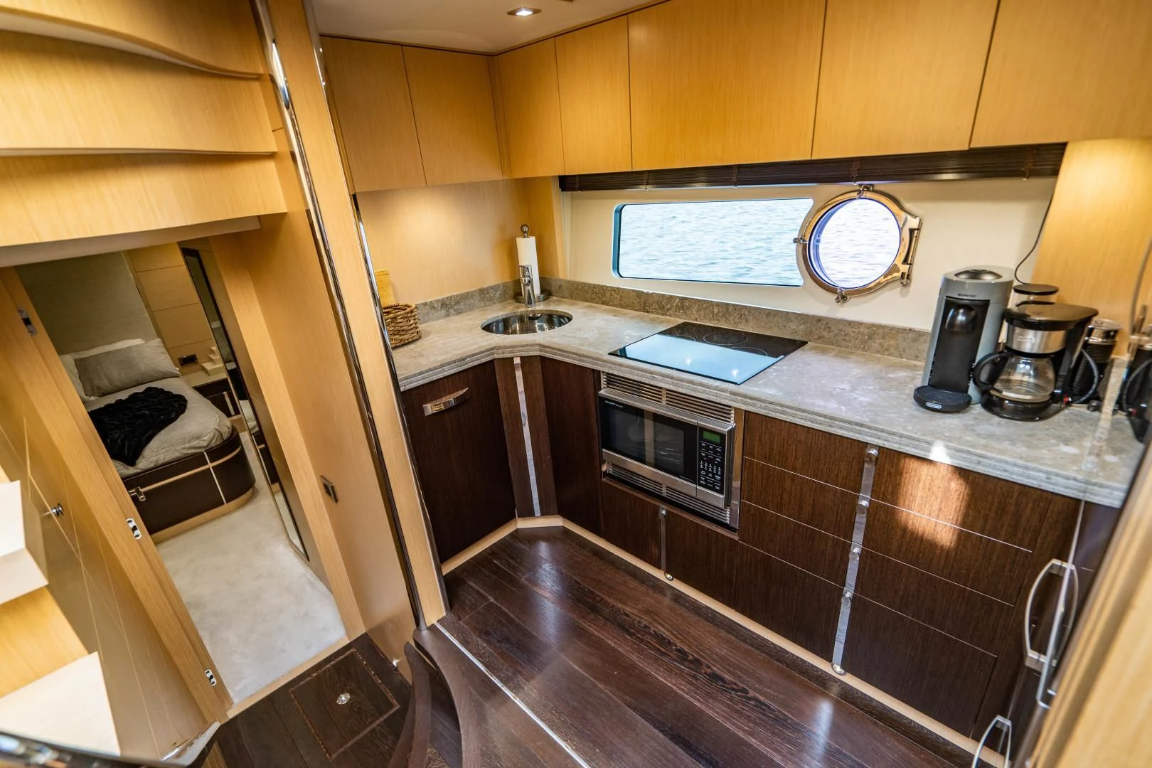 a kitchen with wooden cabinets aboard SUBMARINO Yacht for Sale