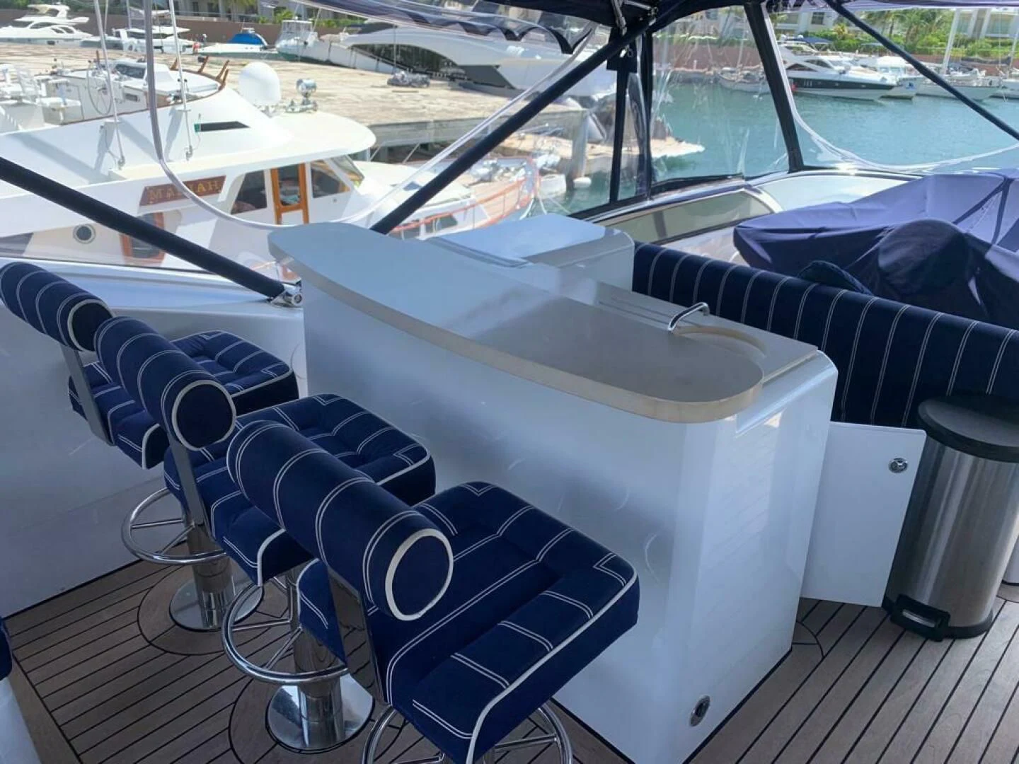 a table and chairs on a deck aboard JULCAN II Yacht for Sale
