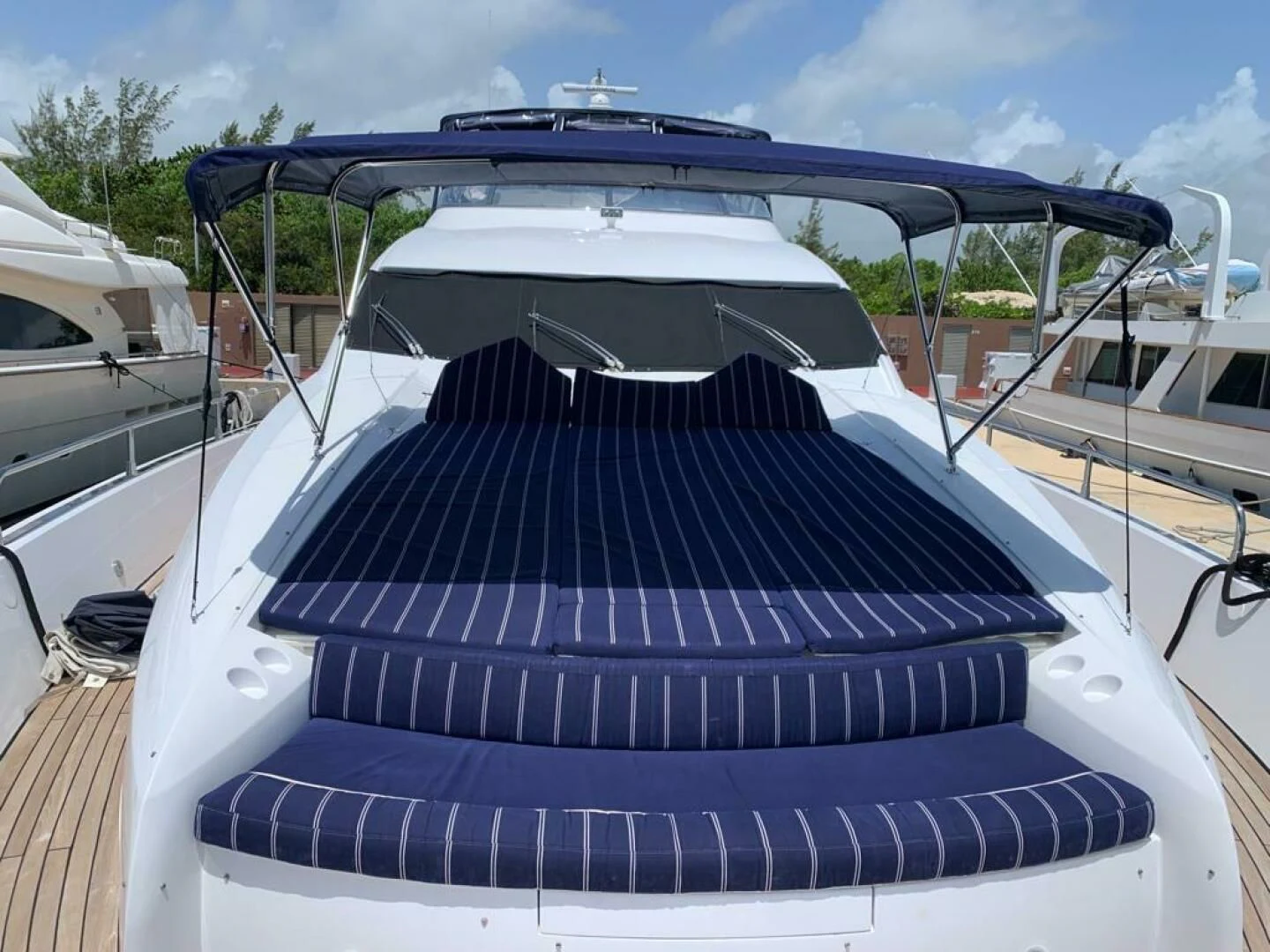 a boat with a striped roof aboard JULCAN II Yacht for Sale